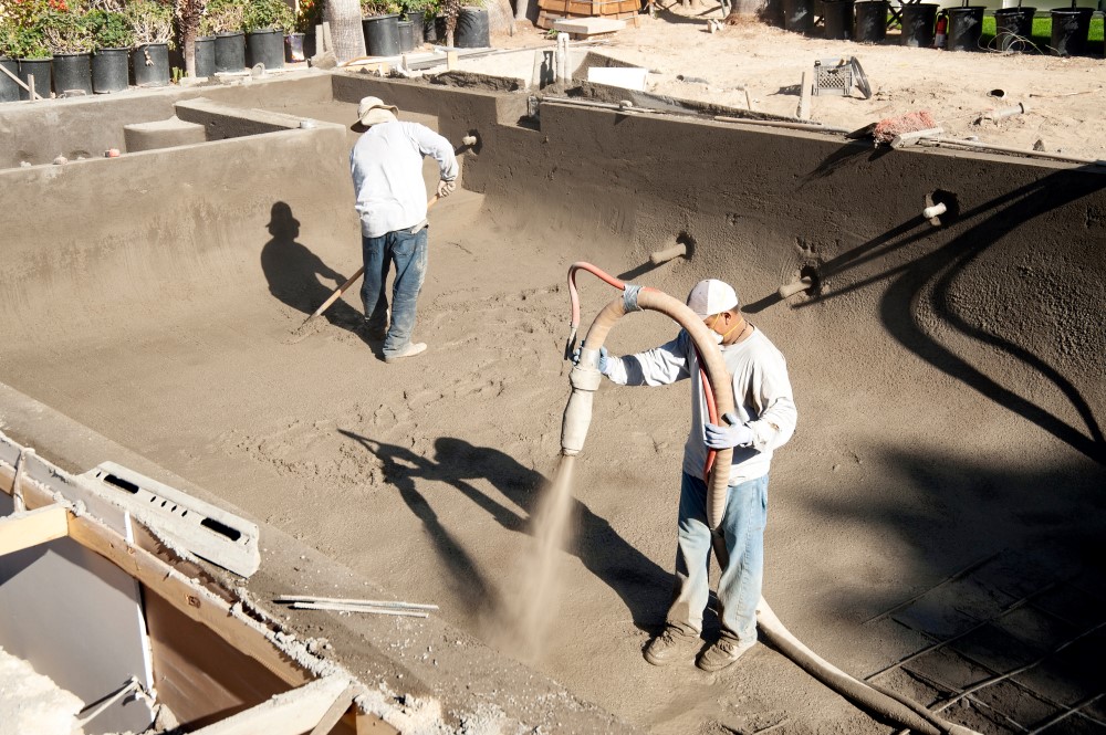 Can the Price of a Pool Change After Signing the Contract in Gulf Breeze? Construction team working on inground pool.