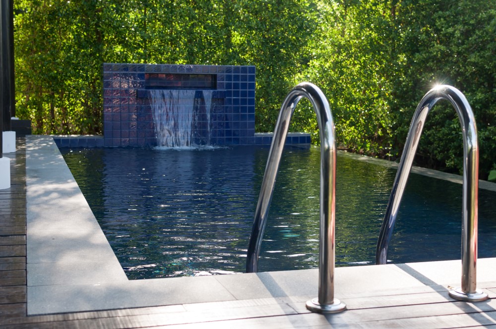 A well-designed small pool located in small backyard space.